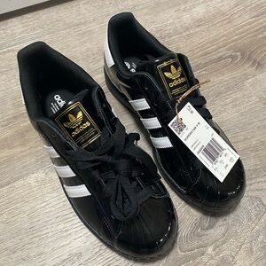 adidas Black & White Superstar Sneakers with Gold Tongue Logo